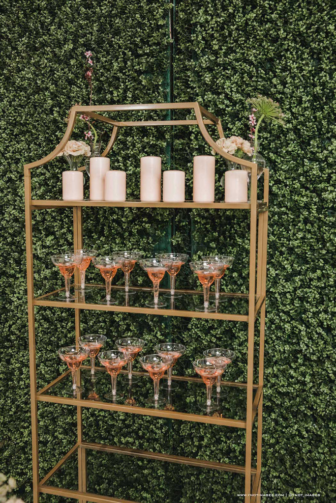 champagne and blush glasses and candles