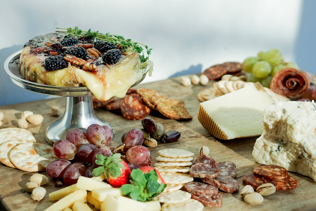 Blackberry and thyme baked brie with meat and cheese spread