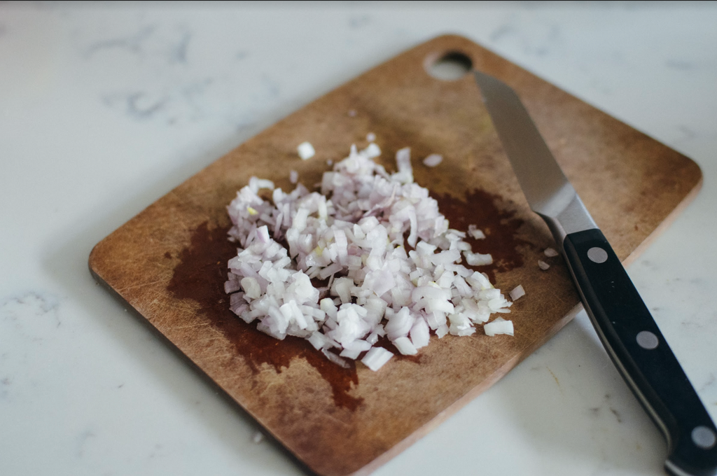 Simple Southern Cracker Salad Recipe- minced shallot on cutting board