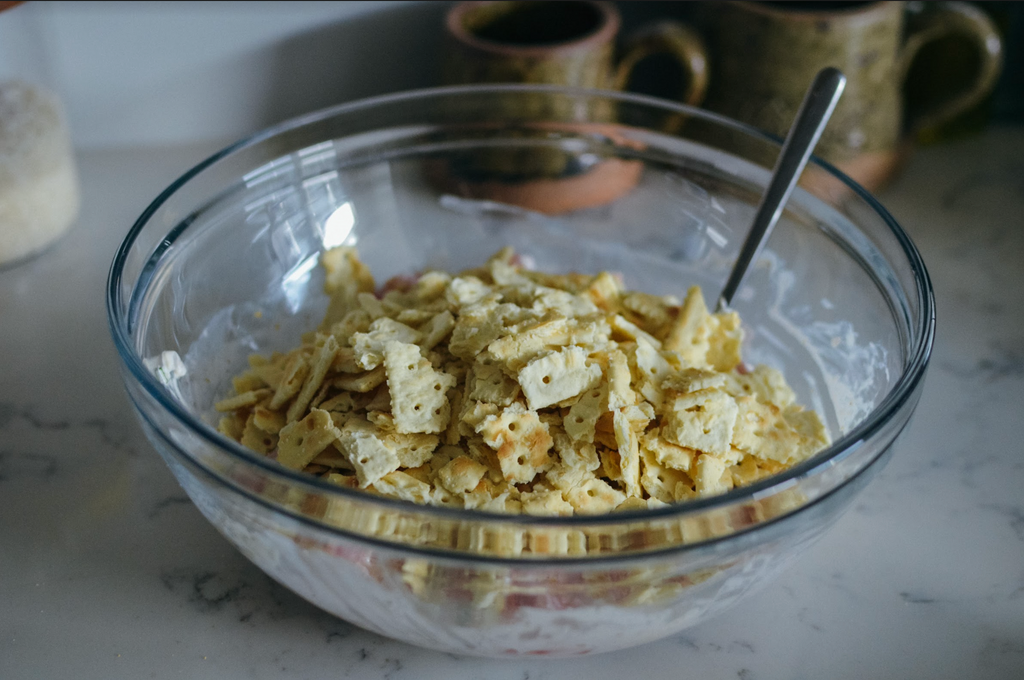 Simple Southern Cracker Salad Recipe- crushed crackers in glass mixing bowl