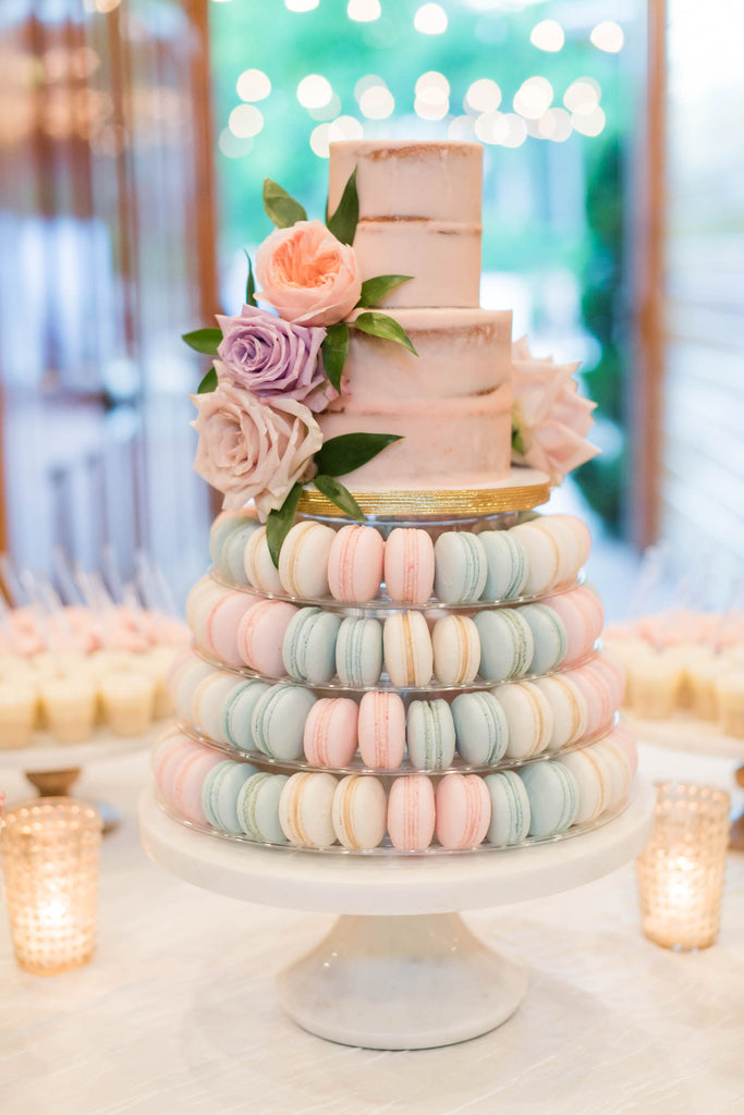 pastel wedding cake and macarons