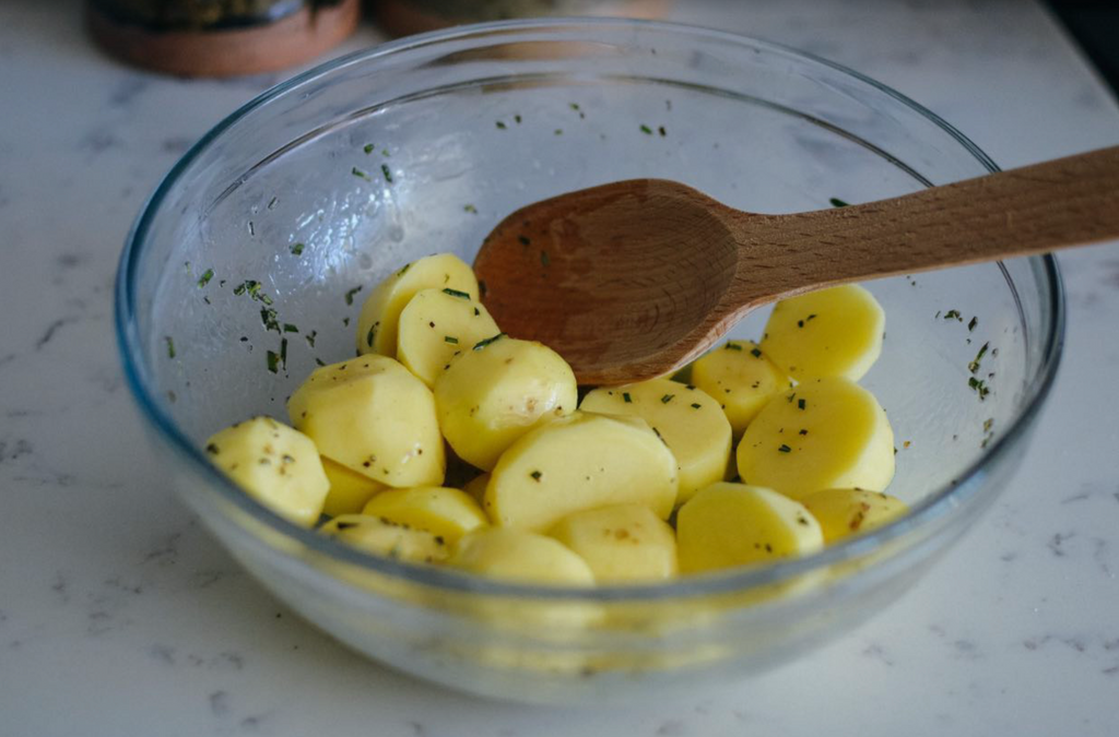rosemary garlic melting potatoes recipe coating potatoes in butter and spices