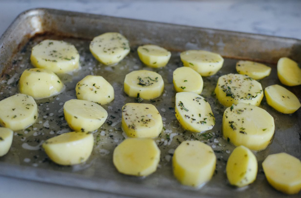 rosemary garlic melting potatoes recipe potatoes on pan