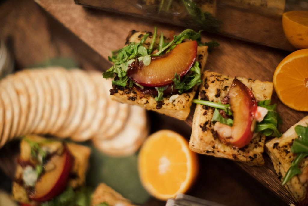 Stylish Evening Soiree in Mountain Brook grazing table peach and arugula bites