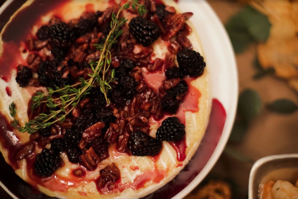 Stylish Evening Soiree in Mountain Brook grazing table blackberry and raspberry pecan baked brie