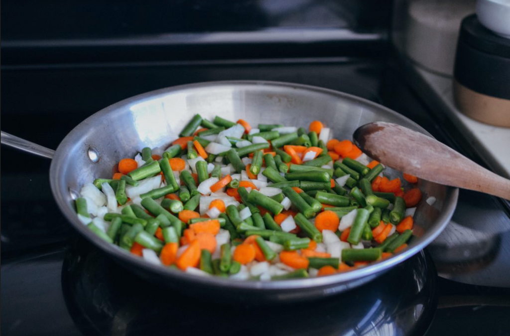 simmering vegetables on stove