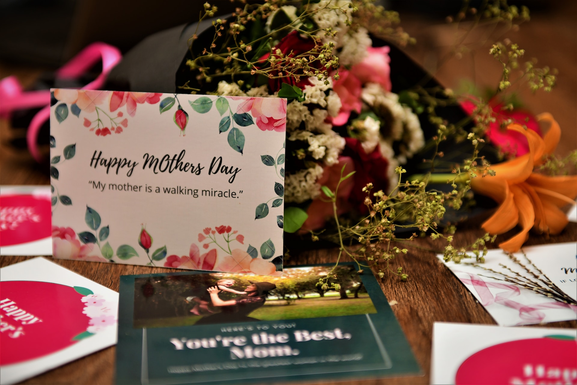 Mothers Day cards and flowers on table