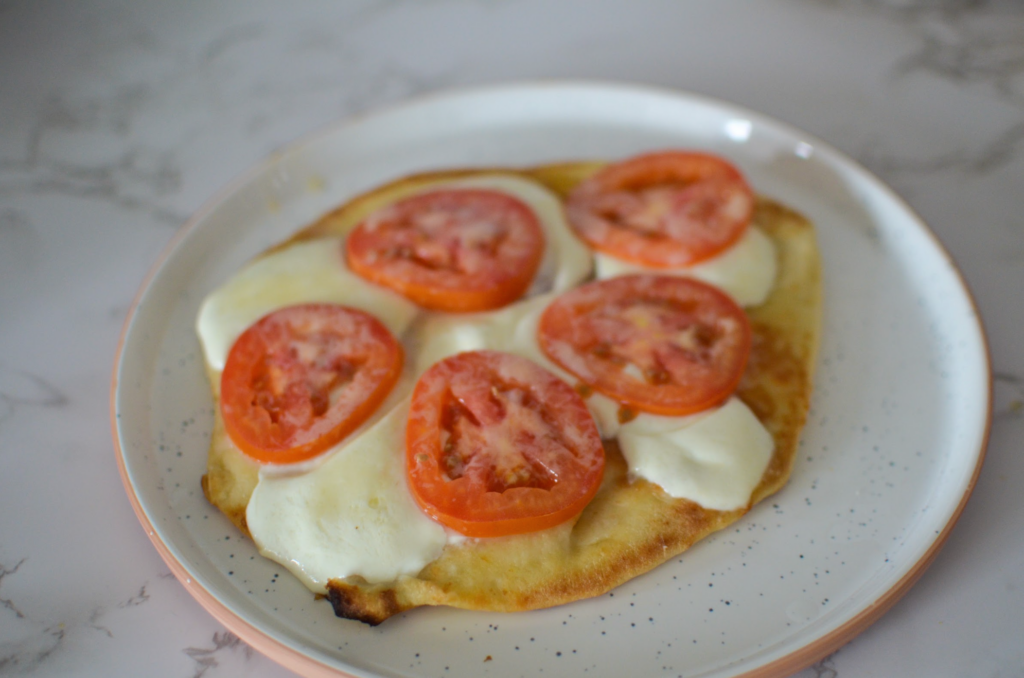 naan bread with tomatoes and cheese